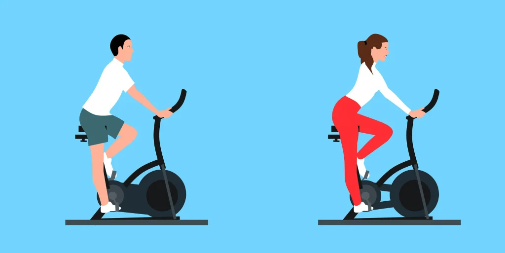 Osoby trenujące na rowerach stacjonarnych